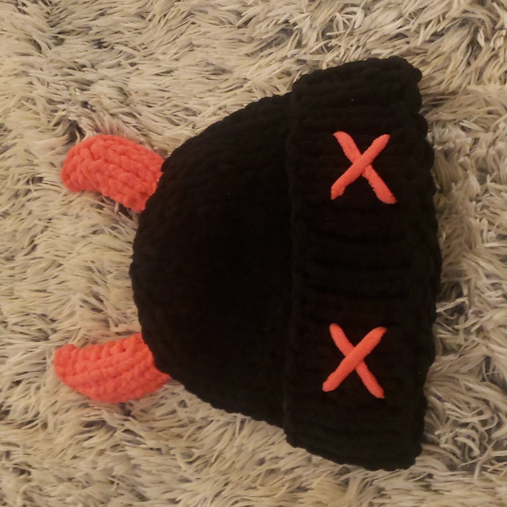 Cute black and pink knitted beanie with horns